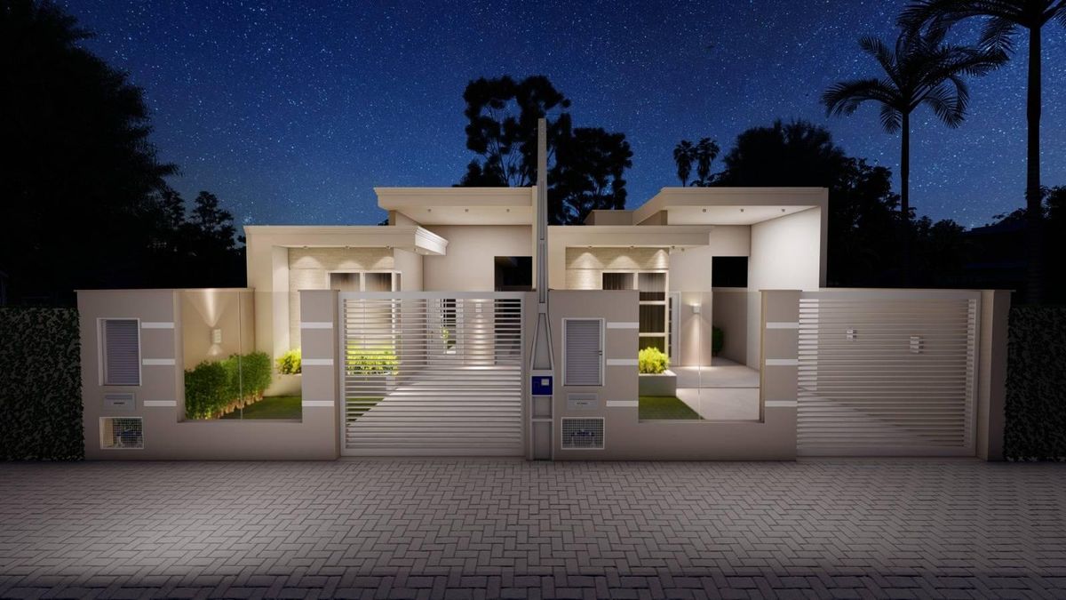 Residência moderna de duas andares com muro, iluminação externa e portas de correr.